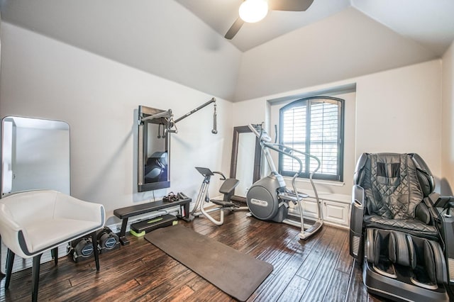 workout room featuring vaulted ceiling, dark wood-type flooring, and ceiling fan