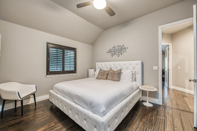 bedroom featuring dark hardwood / wood-style flooring, lofted ceiling, and ceiling fan