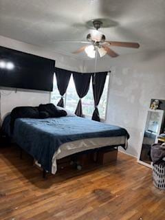 bedroom featuring ceiling fan and wood-type flooring