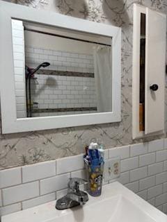 bathroom with a shower with shower curtain