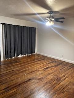 unfurnished room featuring dark hardwood / wood-style floors