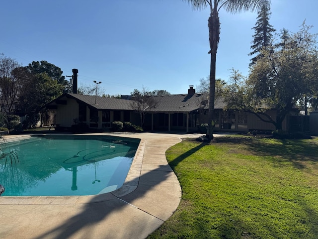 1590 W Escalon, Fresno, CA 93711 - outdoor pool featuring a yard and a patio area