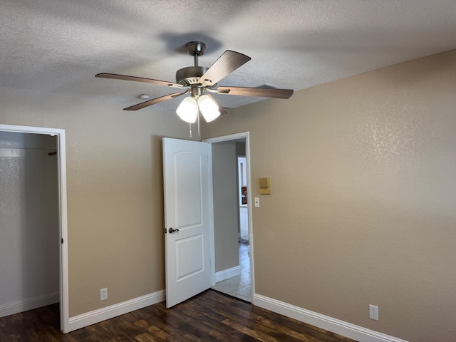 1590 W Escalon, Fresno, CA 93711 - unfurnished bedroom with dark wood-type flooring, ceiling fan, a textured ceiling, and a closet