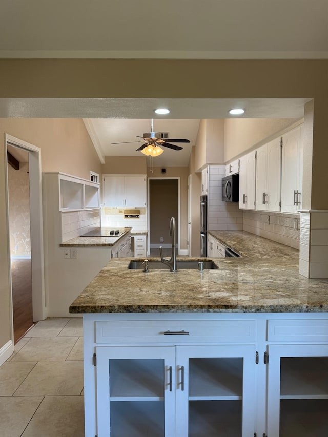 1590 W Escalon, Fresno, CA 93711 - kitchen featuring black appliances, a peninsula, backsplash, stone counters, and ceiling fan