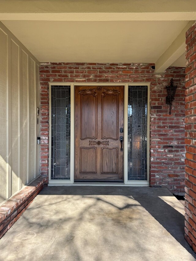 1590 W Escalon, Fresno, CA 93711 - view of exterior entry with brick siding and a porch