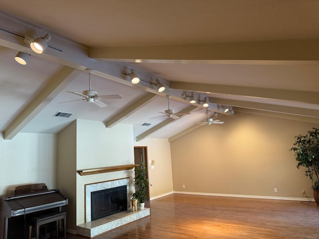 1590 W Escalon, Fresno, CA 93711 - unfurnished living room featuring wood finished floors, ceiling fan, a fireplace, and rail lighting