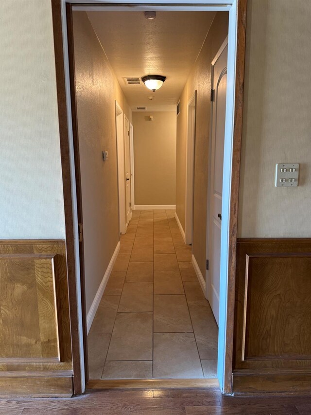 1590 W Escalon, Fresno, CA 93711 - hallway featuring tile patterned floors and baseboards