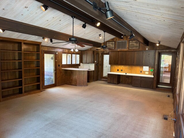 1590 W Escalon, Fresno, CA 93711 - kitchen with wood walls, a peninsula, plenty of natural light, light colored carpet, and light countertops