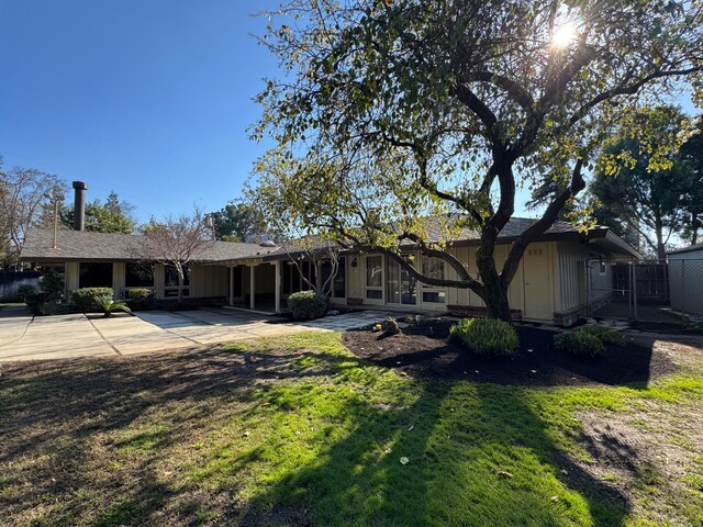1590 W Escalon, Fresno, CA 93711 - back of house featuring a patio, a gate, and concrete driveway