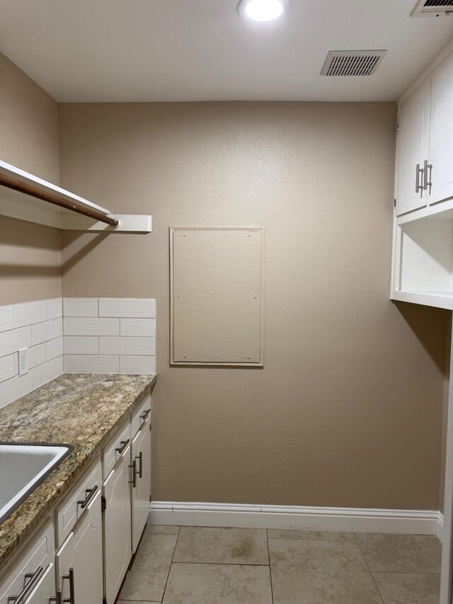 1590 W Escalon, Fresno, CA 93711 - laundry room featuring light tile patterned floors