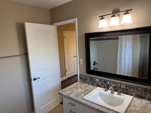 1590 W Escalon, Fresno, CA 93711 - full bathroom featuring vanity, a shower with shower curtain, and backsplash