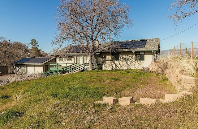 view of front of home with solar panels