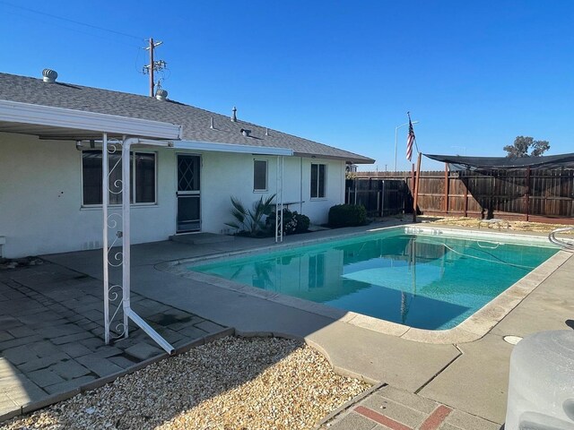 129 N Armstrong Ave, Fowler, CA 93625 - view of pool featuring a fenced backyard and a patio