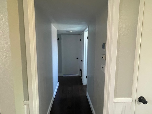 129 N Armstrong Ave, Fowler, CA 93625 - hall with baseboards and dark wood-style floors