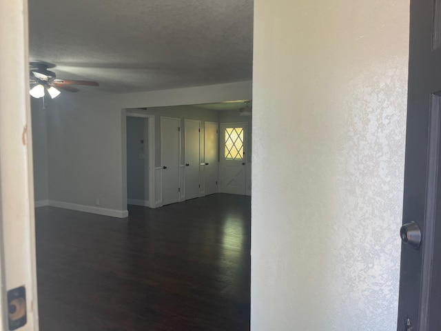 129 N Armstrong Ave, Fowler, CA 93625 - spare room with a ceiling fan, dark wood finished floors, and baseboards