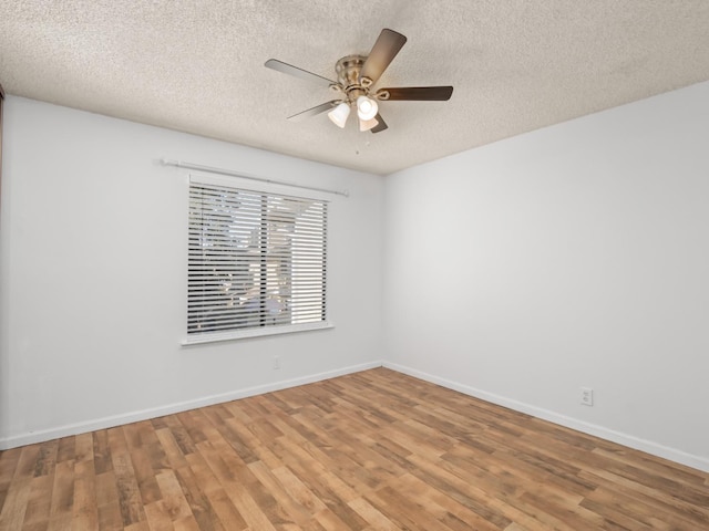 unfurnished room with hardwood / wood-style floors, a textured ceiling, and ceiling fan