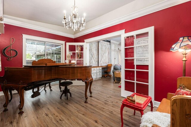 misc room with a notable chandelier and hardwood / wood-style flooring