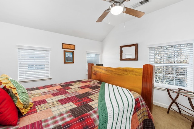 bedroom with lofted ceiling, ceiling fan, and carpet