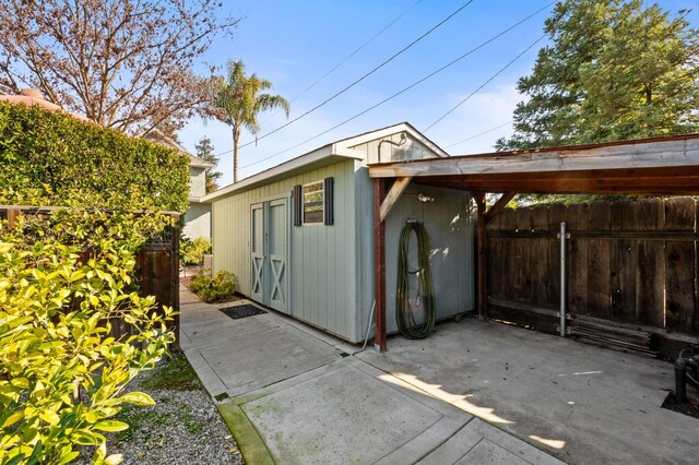 view of property exterior with an outbuilding