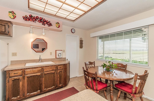 3670 S Newmark Ave, Sanger, CA 93654 - dining area featuring light tile patterned floors and baseboards