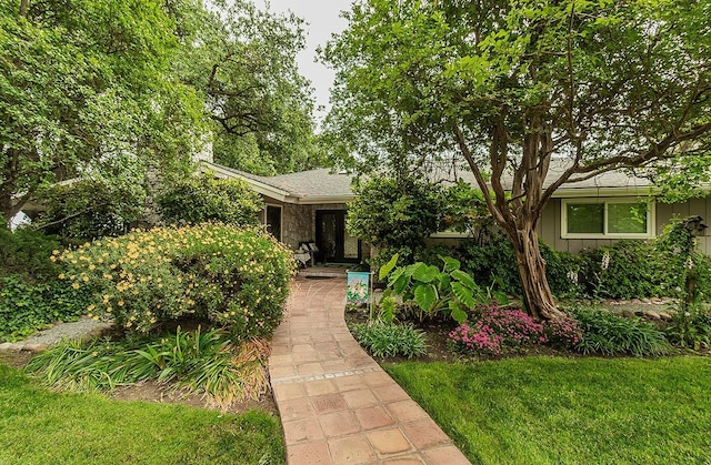 3670 S Newmark Ave, Sanger, CA 93654 - view of front of house with board and batten siding and a front yard