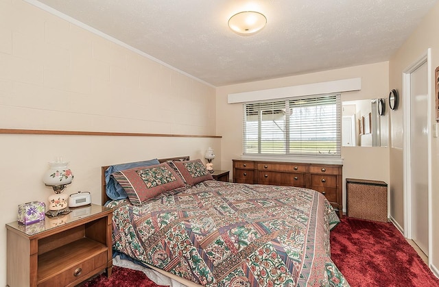 3670 S Newmark Ave, Sanger, CA 93654 - bedroom featuring dark carpet, crown molding, and a textured ceiling
