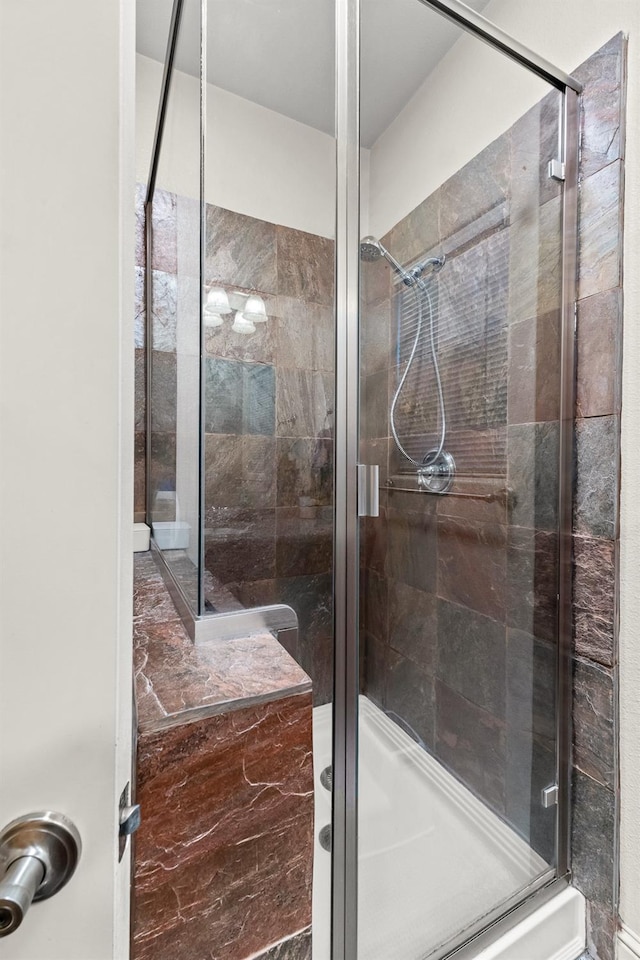 bathroom with an enclosed shower