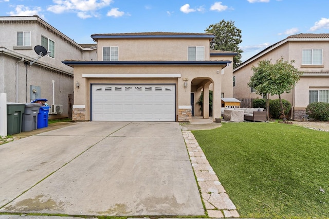 view of front property featuring a garage and a front lawn