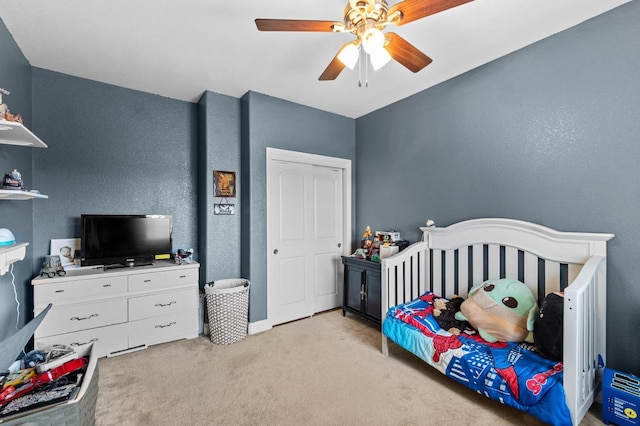 bedroom with light colored carpet and ceiling fan