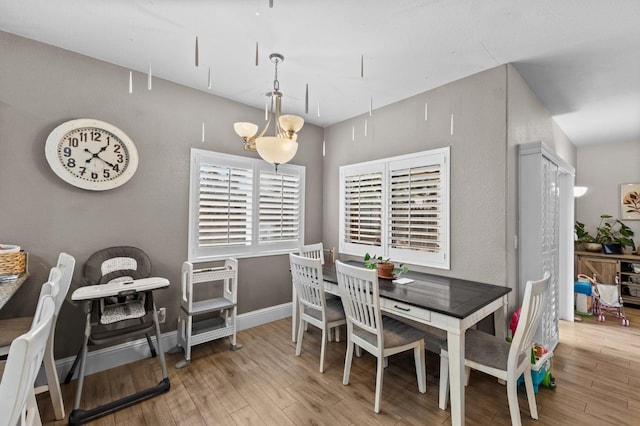 dining area with light wood-type flooring