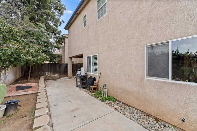 view of property exterior featuring a patio