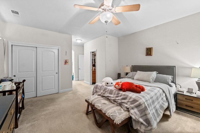 bedroom with light carpet and ceiling fan