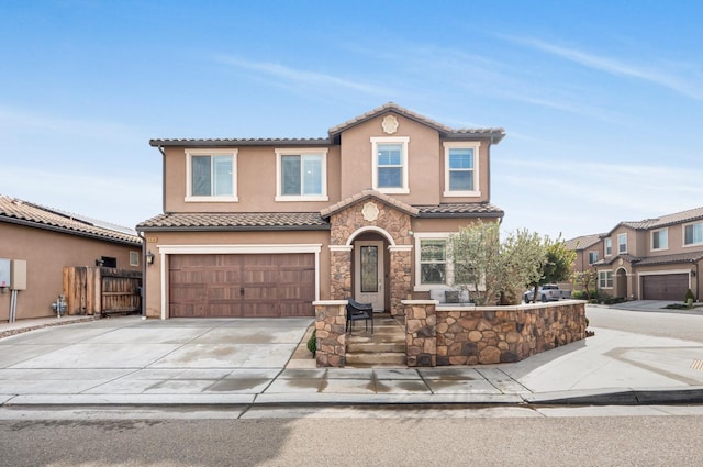 mediterranean / spanish-style home featuring a garage