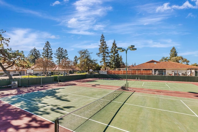 view of sport court with basketball hoop