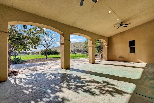 view of patio featuring ceiling fan