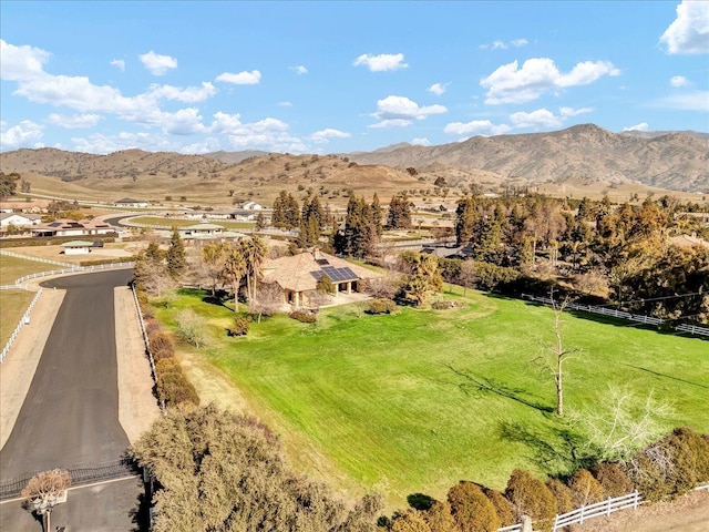 drone / aerial view with a mountain view and a rural view