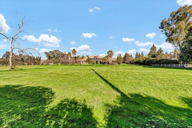 view of yard with a rural view