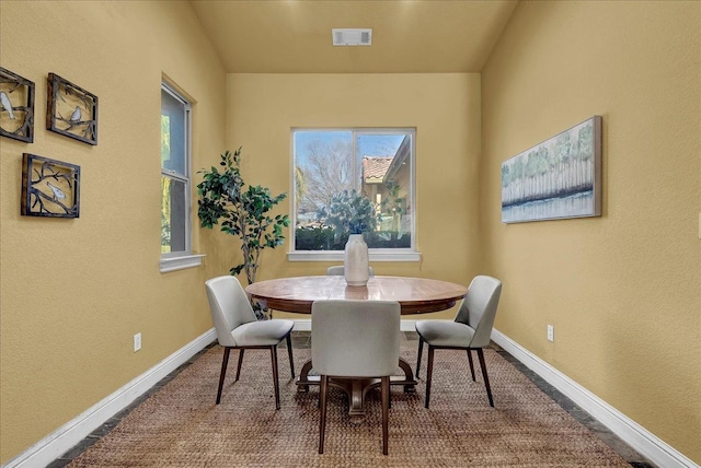 dining room featuring carpet