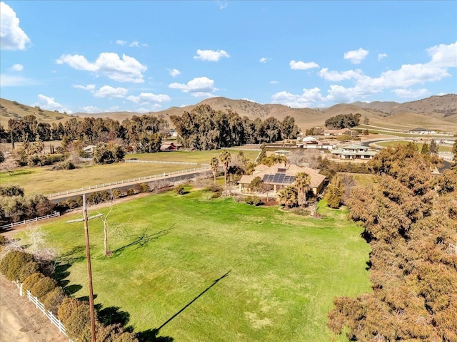 drone / aerial view featuring a rural view and a mountain view