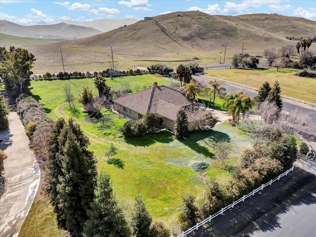 drone / aerial view featuring a rural view and a mountain view