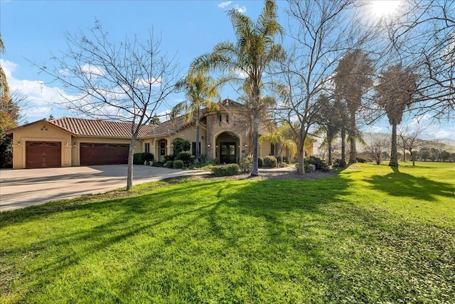 view of front of house with a garage and a front lawn