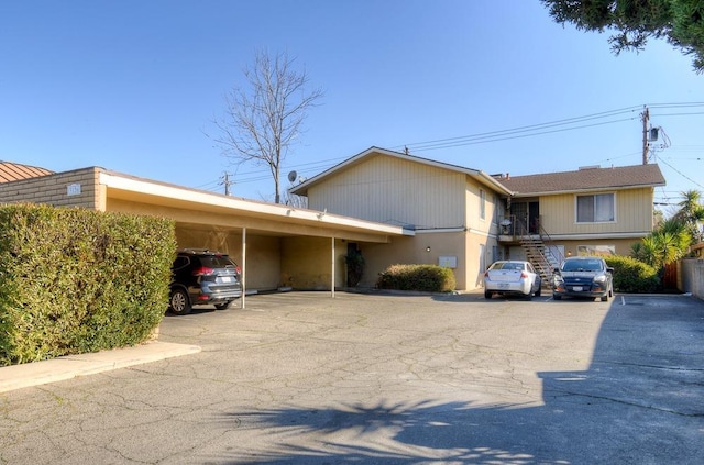 view of front of home with a carport