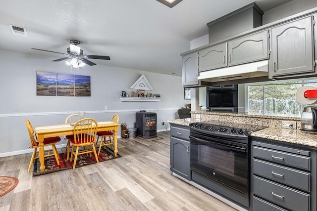 kitchen featuring ceiling fan, black electric range, gray cabinetry, and light wood-type flooring