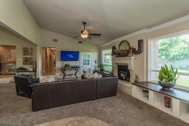 carpeted living room with vaulted ceiling, ornamental molding, and ceiling fan