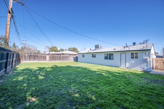 view of yard with central AC unit