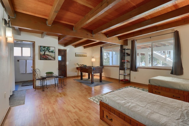 interior space featuring beamed ceiling, wood ceiling, and light hardwood / wood-style floors