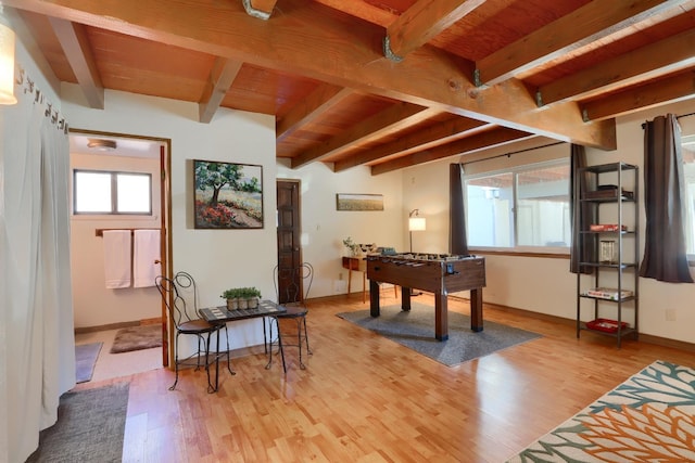 recreation room featuring wood ceiling, beam ceiling, and light hardwood / wood-style flooring