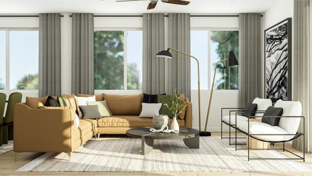 living area featuring ceiling fan, a healthy amount of sunlight, and light wood-type flooring