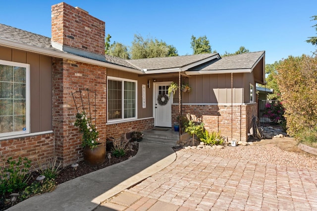 doorway to property with a patio