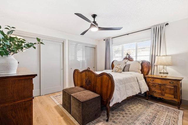 bedroom featuring ceiling fan, a textured ceiling, and light wood-type flooring